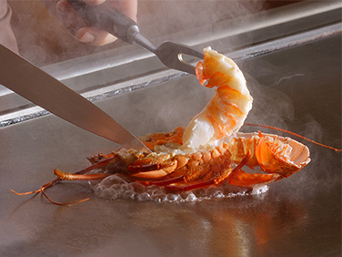 Fresh spiny lobster cooked on a hot steel plate