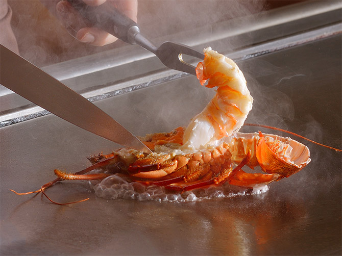 Fresh spiny lobster cooked on a hot steel plate